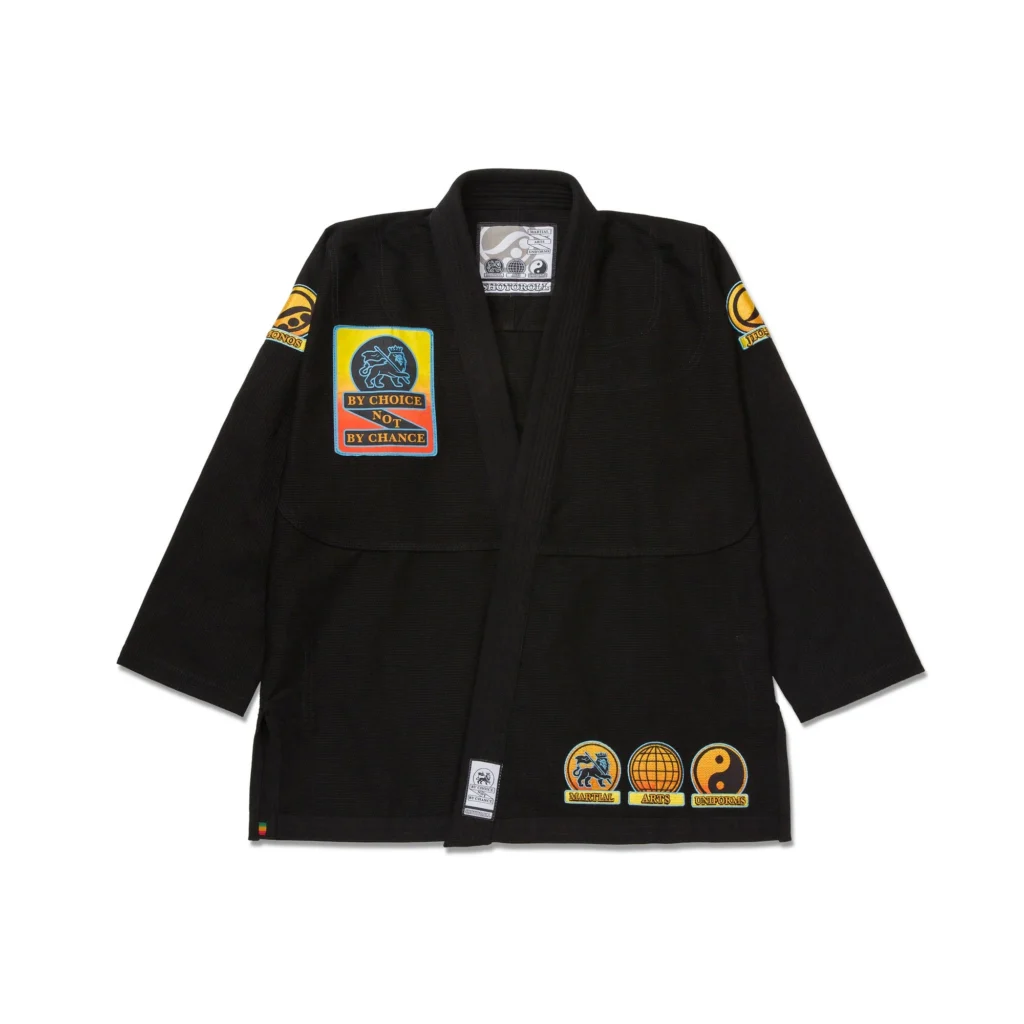 Shoyoroll Batch #143 Malibu BJJ gi in white with coastal gradient patches on a black background, showcasing 450 GSM pearl weave fabric.