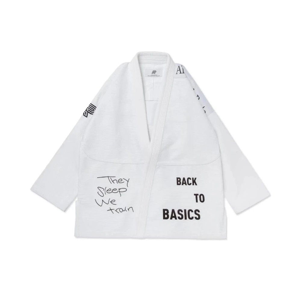 Albino & Preto TSWT BJJ Gi with embroidered logo, displayed on a white background, featuring 450 GSM pearl weave fabric and reinforced stitching for jiu-jitsu.