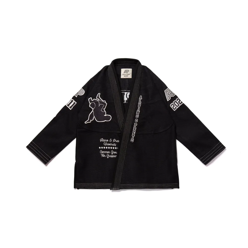 University BJJ Gi Albino and Preto Batch #102 black Gi with bag showing durable stitching and premium Brazilian Jiu Jitsu uniform design